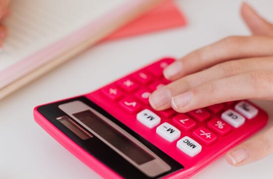 close up of a girl using a calculator